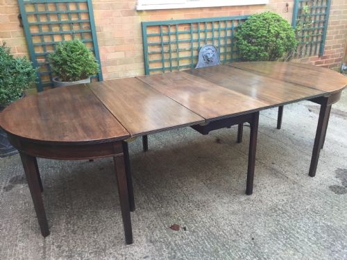 fig 3. Highly versatile C18th George III period mahogany D-ended dining table with various configuration options in 'as found' country-house condition.