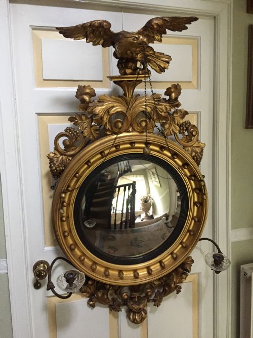 Large and Impressive Regency Period Carved Gilt-wood Frame Girandole Convex Mirror with Eagle Surmount.