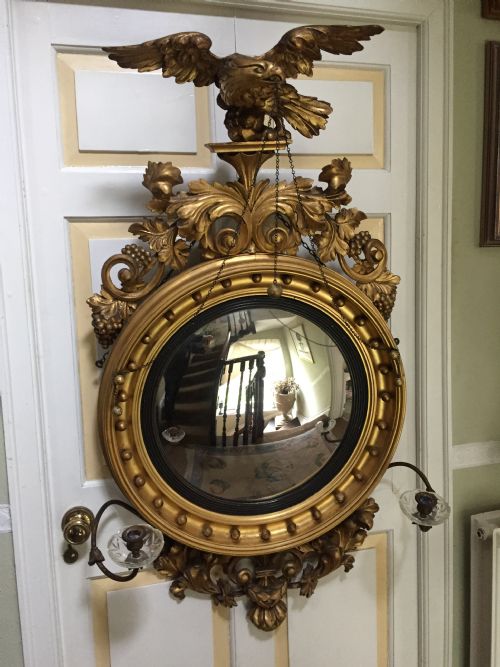 fig 1. Large and impressive Regency period carved gilt-wood frame girandole convex mirror with eagle surmount.