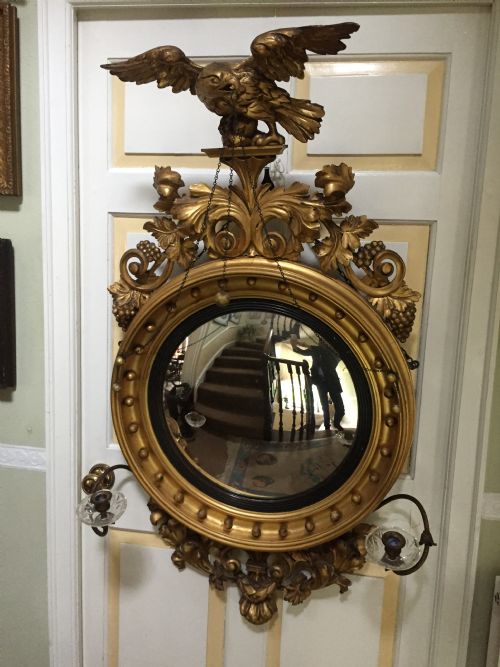 fig 2. Large and impressive Regency period carved gilt-wood frame girandole convex mirror with eagle surmount.