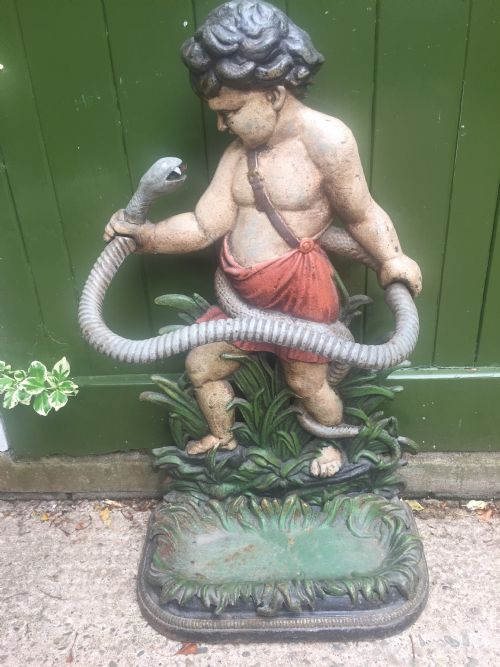 MID C19TH CASTIRON STICKSTAND DEPICTING THE YOUNG HERCULES - ADDITIONAL PHOTO 1