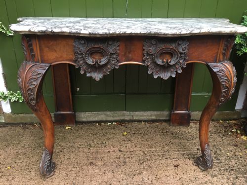 fig 1. Exhuberant C19th Irish walnut console table with a rare Breccia marble slab top .