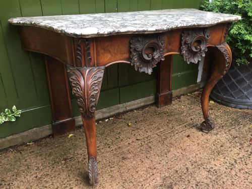 fig 2. Exhuberant C19th Irish walnut console table with a rare Breccia marble slab top .