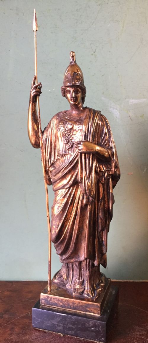 fig 1. A nineteenth-century gilded bronze sculpture depicting the classical goddess Athena holding a spear, standing on a dark marble base.