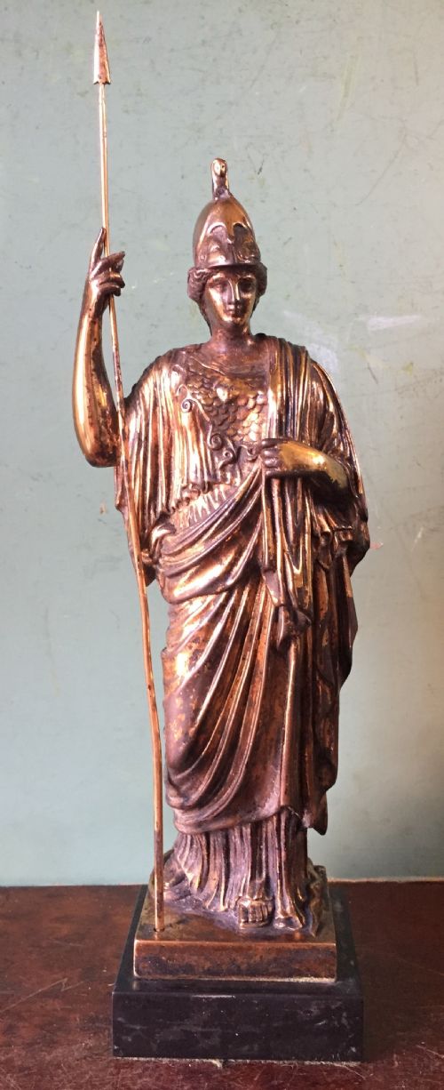 fig 2. A nineteenth-century gilded bronze sculpture depicting the classical goddess Athena holding a spear, standing on a dark marble base.