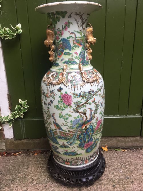 fig 1. Large scale C19th Chinese Cantonese porcelain enamel decorated vase on hardwood stand in repaired 'country house' condition .