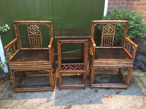 fig 2. Decorative pair of early C20th Chinese polished bamboo and lacquer armchairs and table in the C18th manner .