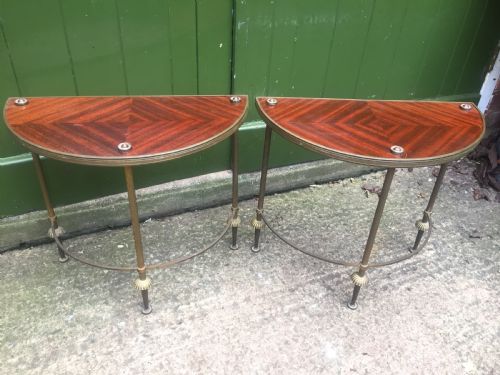 fig 1. Pair of early C20th brass-framed semi-circular drinks or end tables with quarter-veneered mahogany tops.