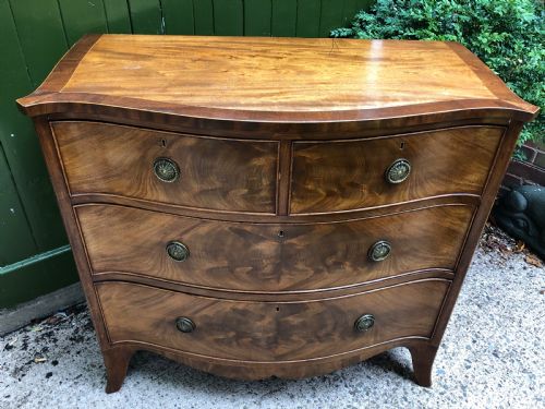 fig 1. Early C19th Regency period mahogany serpentine-outline chest of drawers .