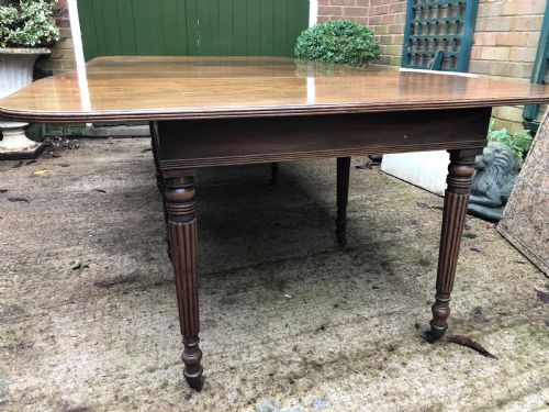 fig 1. Early C19th late George III period mahogany extending dining table of unusual format .