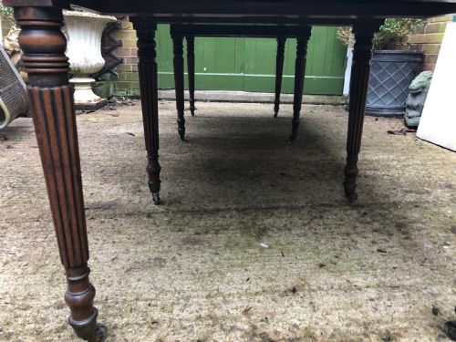 fig 3. Early C19th late George III period mahogany extending dining table of unusual format .