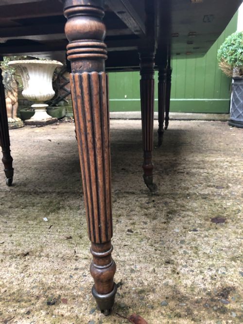fig 5. Early C19th late George III period mahogany extending dining table of unusual format .