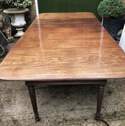 Early C19th Late George III Period Mahogany Extending Dining Table of Unusual Format .