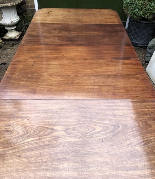 fig 4. Early C19th late George III period mahogany extending dining table of unusual format .