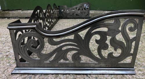 fig 1. Highly decorative C19th cut-steel fire-place guard or fender in the mid C18th Georgian period revival style .