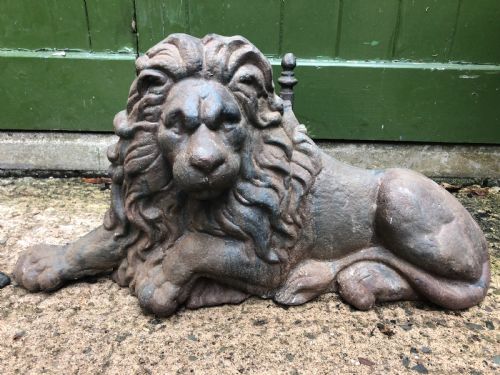 fig 1. Pair of mid C19th cast-iron boot-scrapers in the form of a recumbent lion and a unicorn .