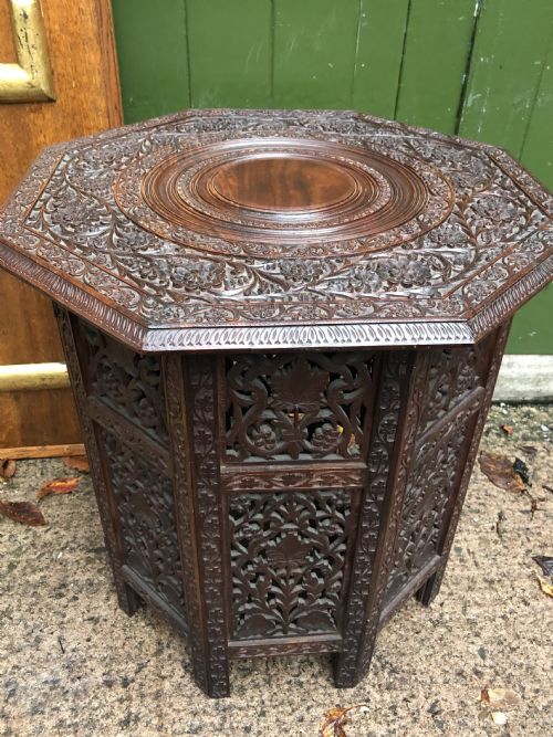 Late C19th Anglo-indian Carved Teak Octagonal Table on a Hinged and Folding Base .
