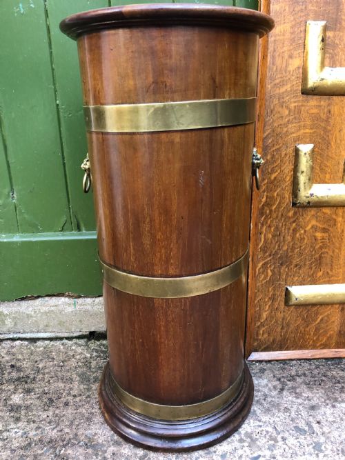 fig 2. Mid C19th brass-banded cylindrical mahogany stick and umbrella stand.