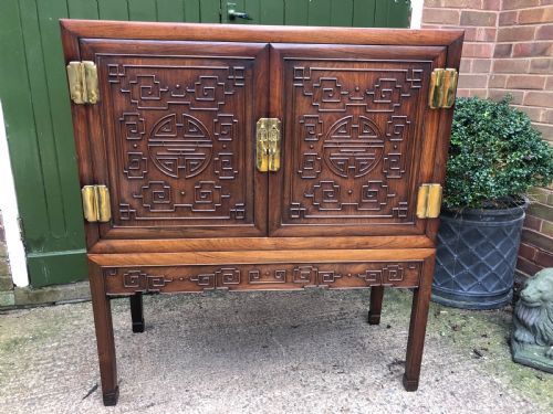 Late C19th/ Early C20th Chinese Qing Dynasty Carved Hardwood Cabinet-on-stand.