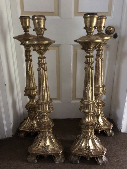 Impressive Set of Four C18th Carved Gilt-wood Altar-type Candlesticks.