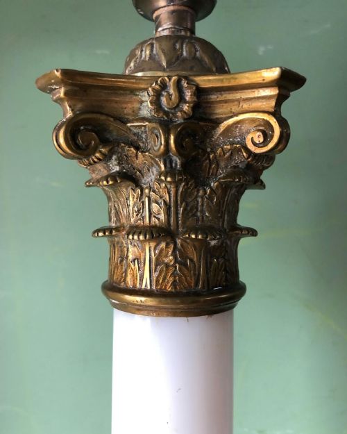 fig 1. Large scale C19th opaline glass column lamp with brass corinthian capital and brass base .