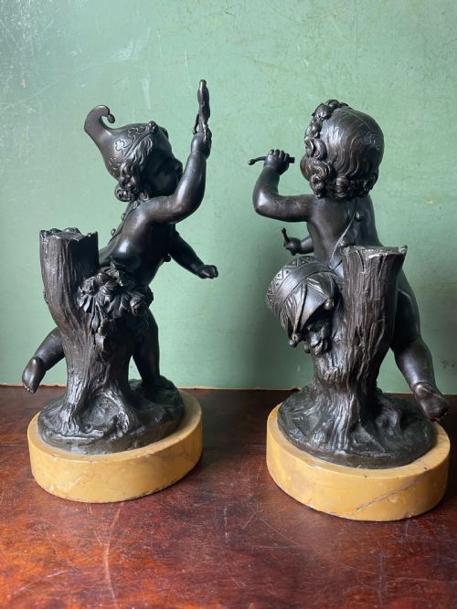 fig 1. Pair of early C19th French bronze allegorical sculptures of cherubs , emblematic of music and comedy after Clodion.