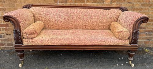 fig 2. Early 19th-century William IV carved mahogany scroll-end sofa upholstered in red and gold patterned damask with matching bolster cushions.