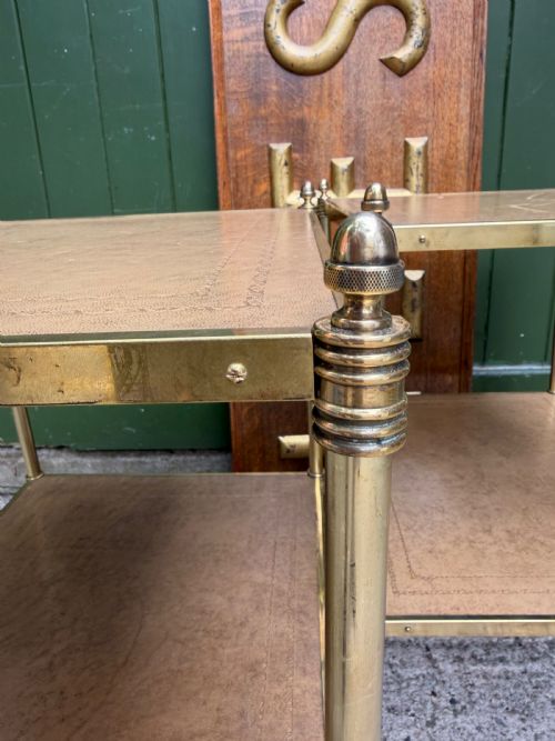 CHIC PAIR OF EARLY C20TH LACQUERED BRASSFRAMED ETAGERES WITH INSET TOOLED PANEL LEATHER SHELVES - ADDITIONAL PHOTO 9