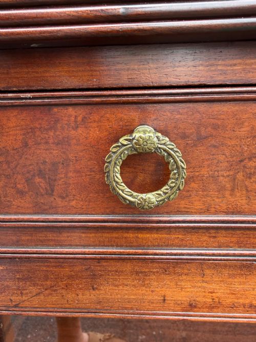fig 3. An early nineteenth-century George III mahogany low bookcase featuring two top frieze drawers over glazed twin doors and turned feet.