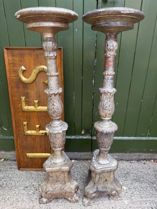 Tall Pair of C18th Italian Carved and Silvered Torcheres or Candle-stands .