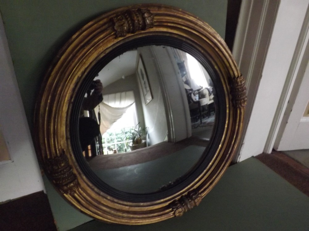 C19th Regency period gilt-wood framed convex mirror.