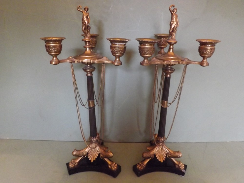 Pair C19th French patinated bronze and ormolu candelabras in the Empire taste.