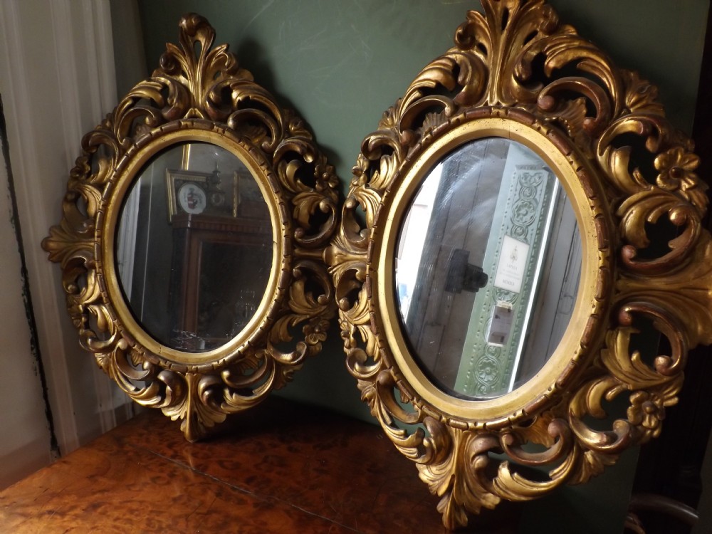 Pair late C19th Italian carved gilt-wood 'Florentine' framed mirrors.