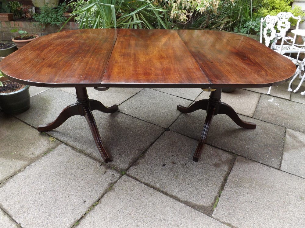 Late C18th George III period mahogany twin-pillar dining table.