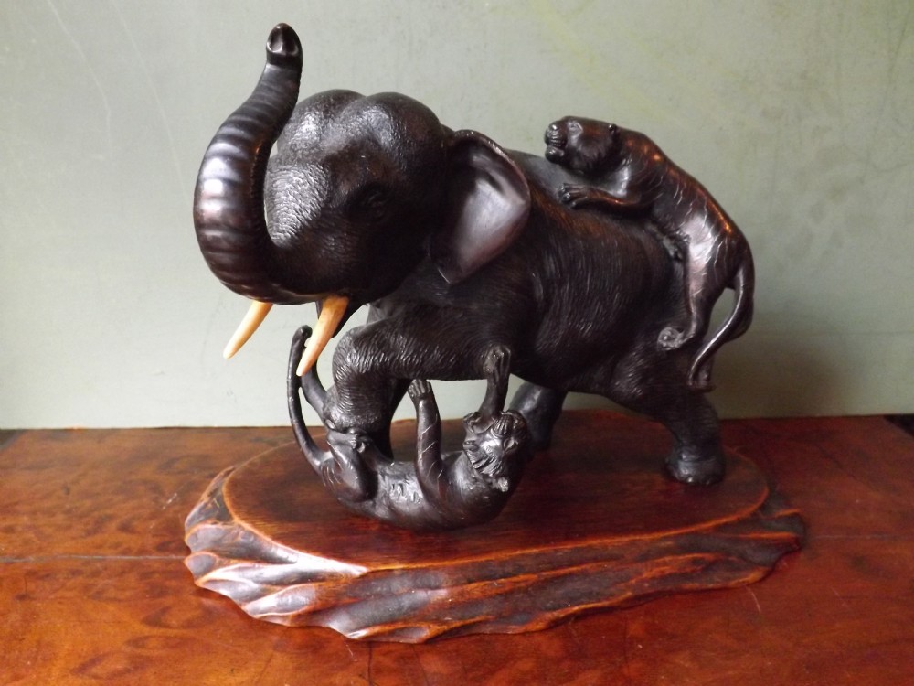 Late C19th Japanese bronze study of an elephant and two attacking tigers.