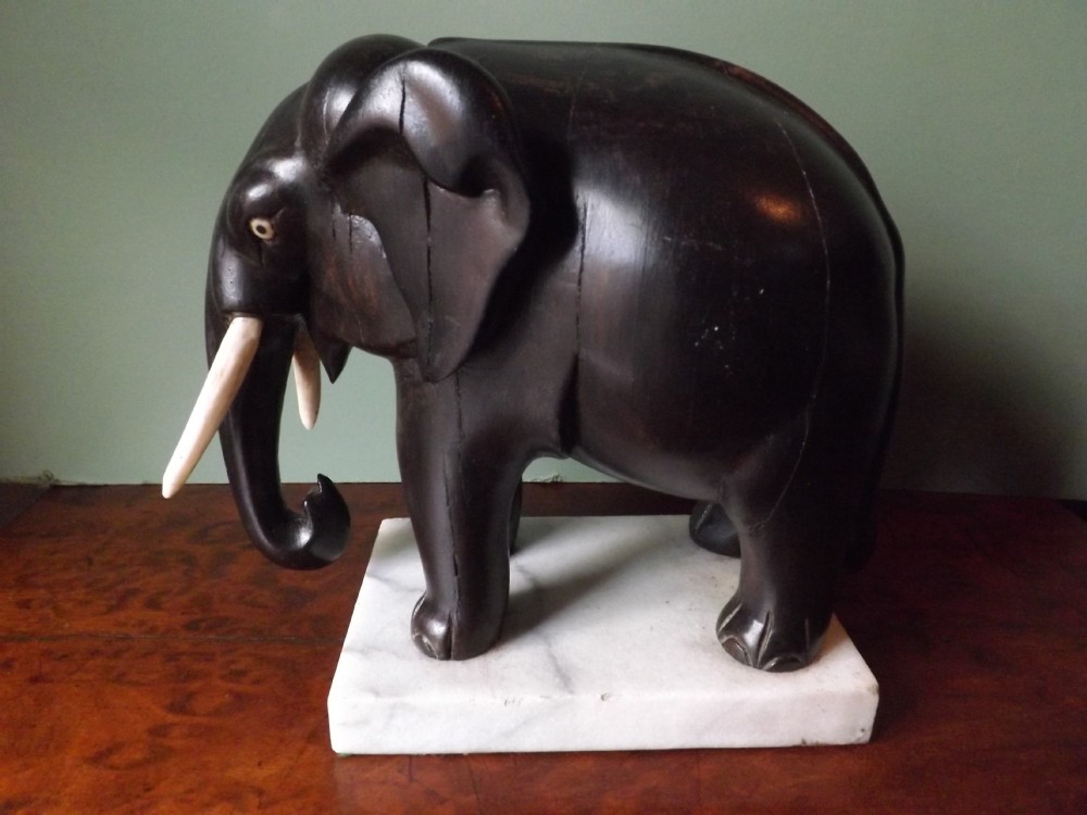 Mid C19th Indian carved ebony elephant.