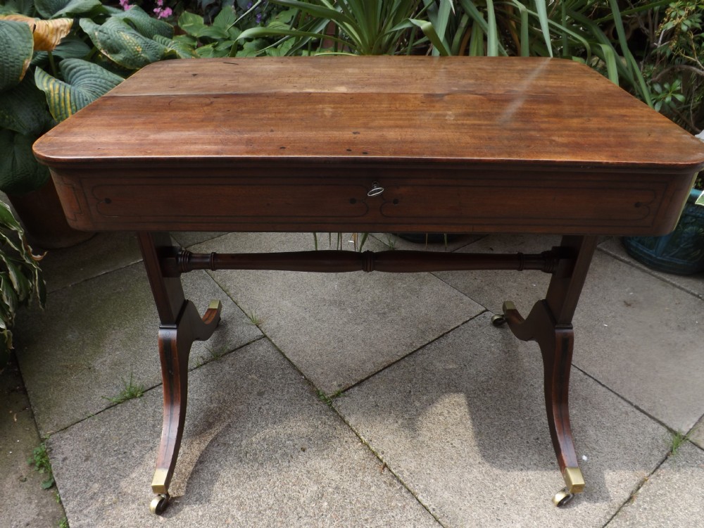 C19th Regency period mahogany 'metamorphic' writing table.