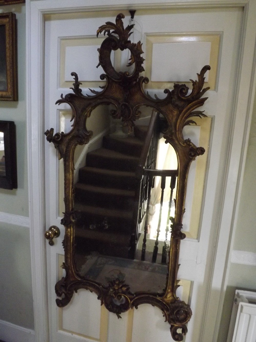 C18th Italian carved gilt-wood framed rococo-style mirror of rococo design .