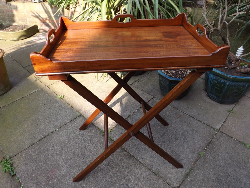 Early C19th George III period mahogany 'butlers' tray on folding stand.