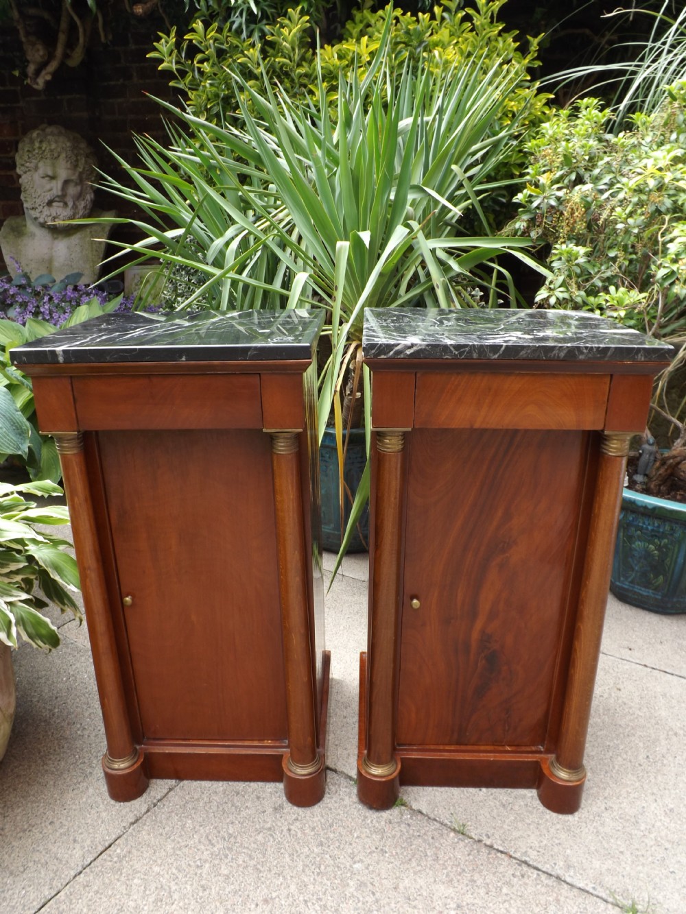 Pair of early C20th French Empire-style mahogany marble-top bedside cupboards. 