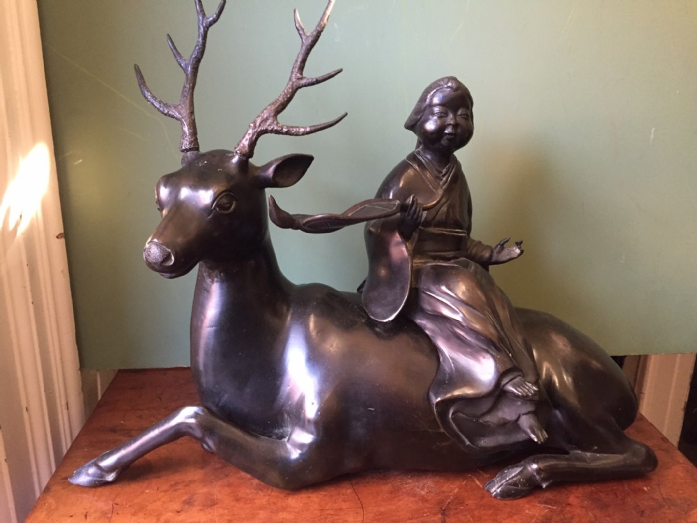 Late C19th Japanese bronze sculptural group of reclining deer and figure astride