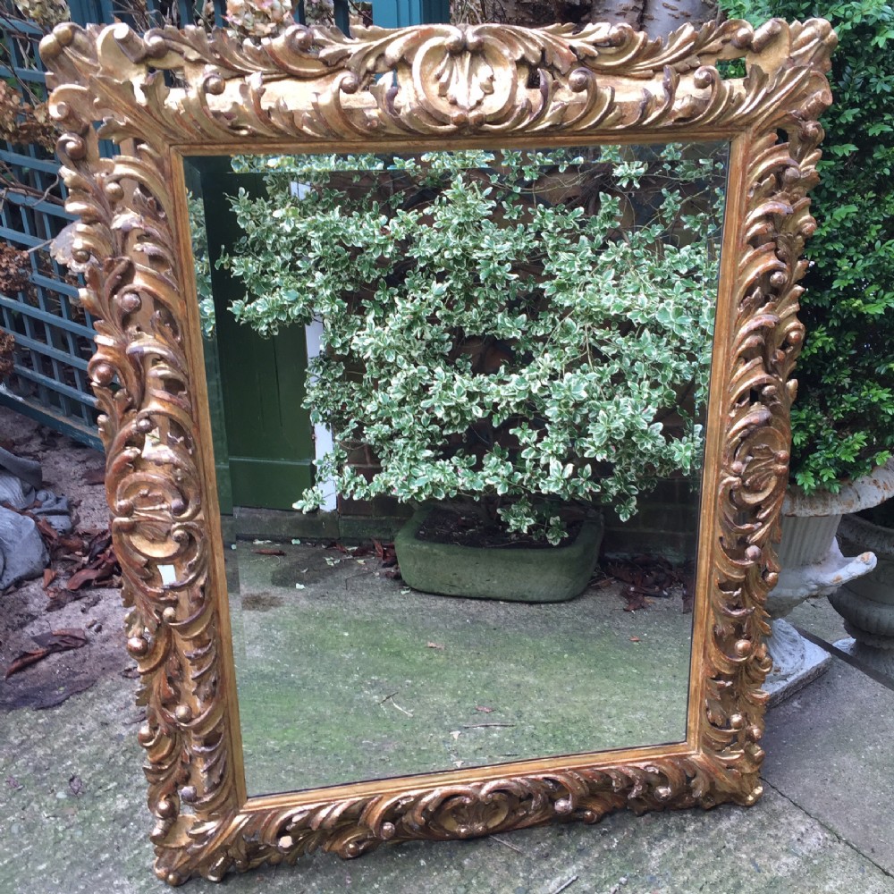 Fine late C18th Italian Florentine carved gilt-wood frame mirror of good large scale.