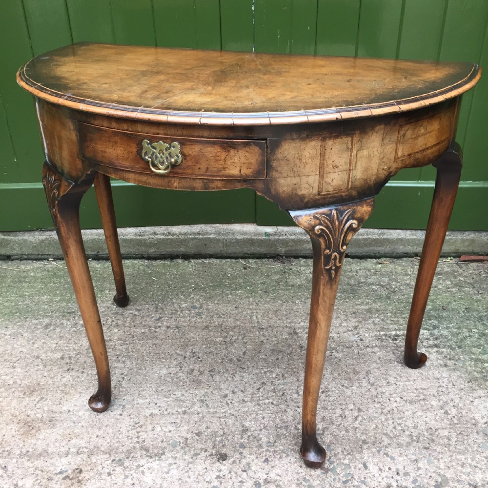 Early C20th walnut demi-lune side table in the early Georgian period style.
