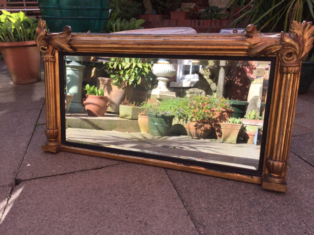 C19th William IV period carved gilt-wood framed over-mantel mirror.
