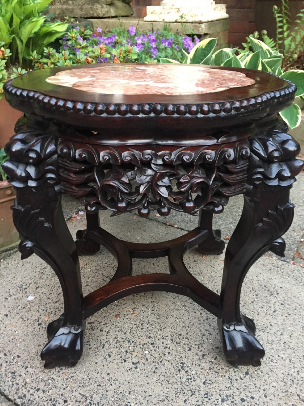 Late C19th Chinese Qing dynasty carved hardwood low jardiniere stand with inset marble top.
