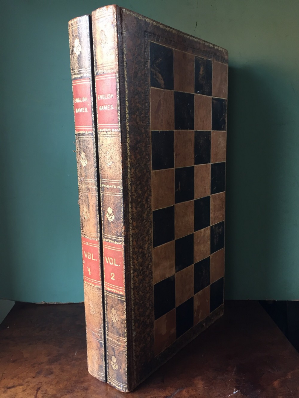 Early C20th leather-bound folding games board modelled as 2 volumes of books