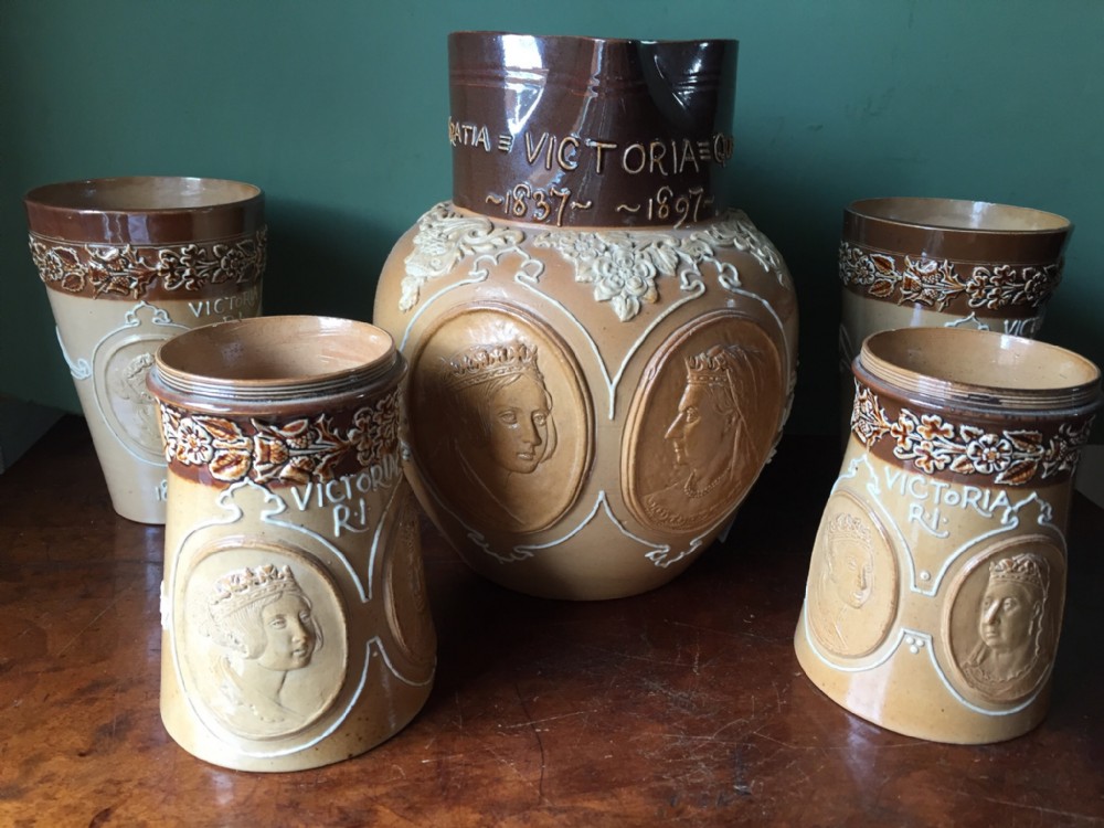 C19th suite of Doulton Lambeth commemorative stoneware salt-glaze jug and drinking vessels.