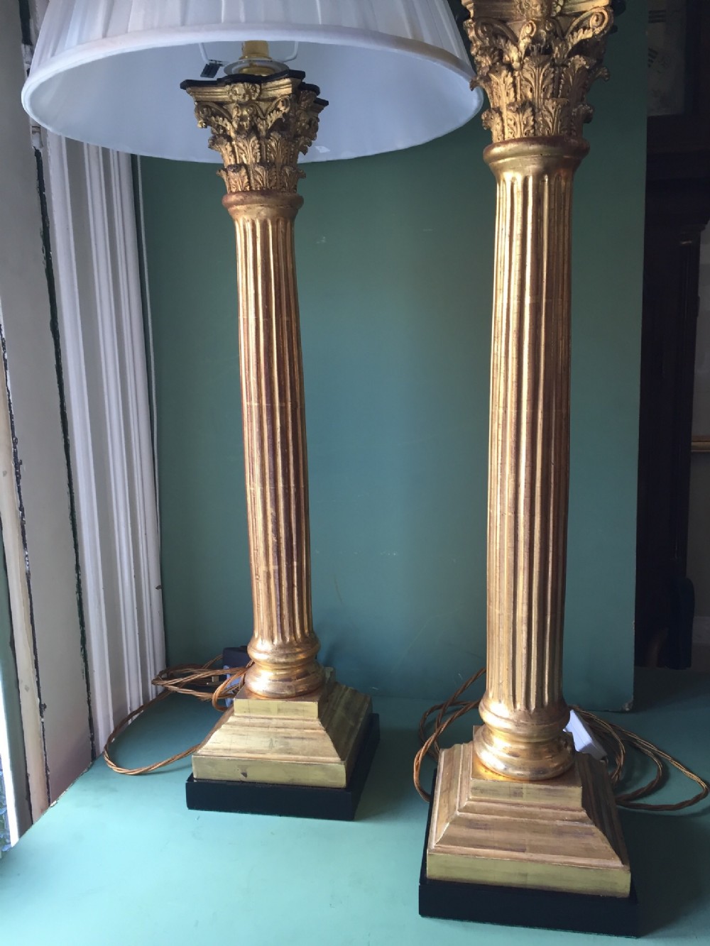 Magnificent pair of late C19th carved gilt-wood Corinthian column table-lamps.