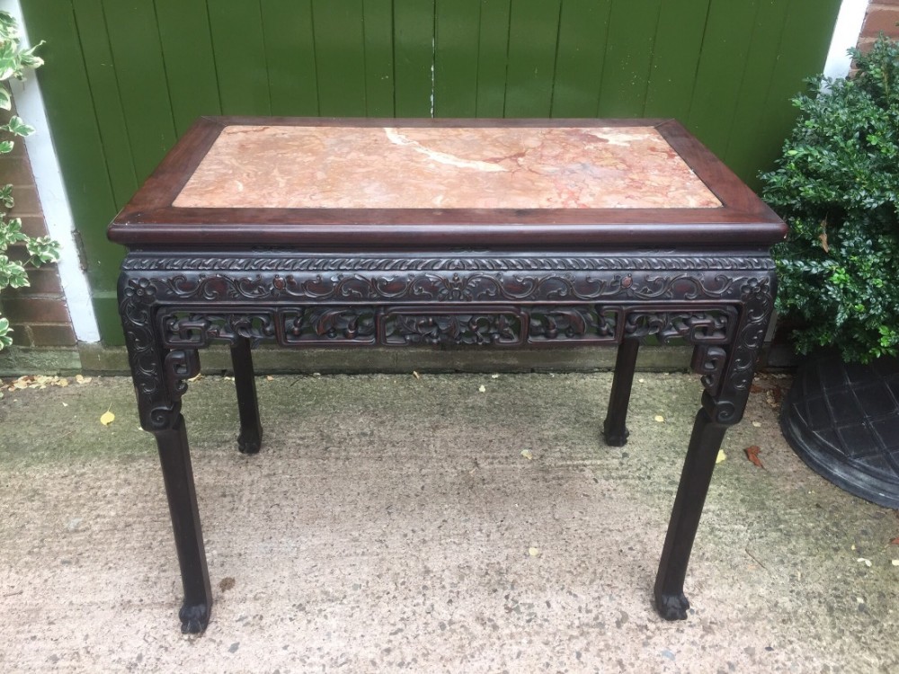 C19th Chinese Qing dynasty carved 'hongmu' marble-topped centre table.