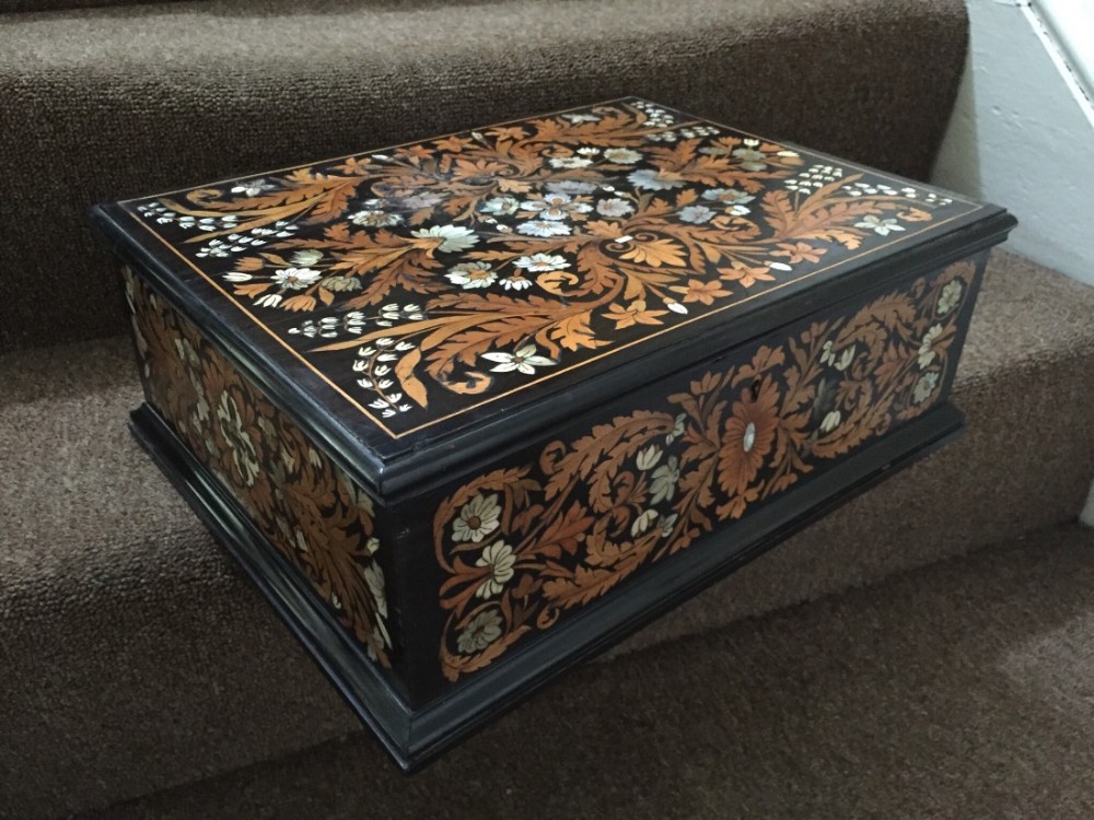 C19th Italian ebony casket with fruit-wood, bone and motherofpearl shall marquetry inlay.